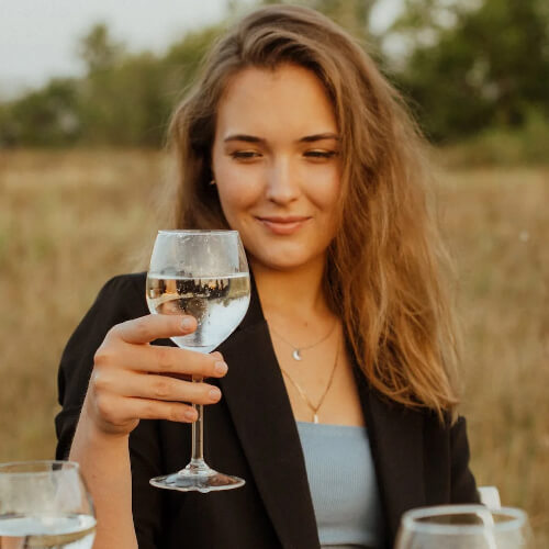 female tasting wine